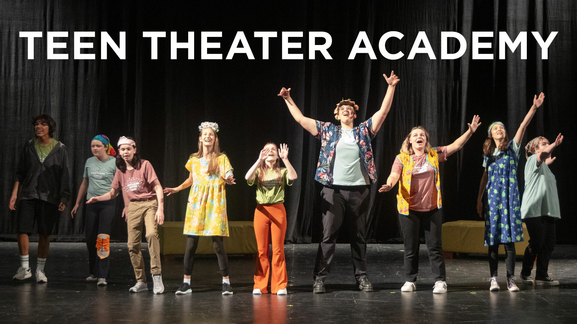 A lineup of several students performing on stage, some with arms raised, under the words "Teen Theater Academy."